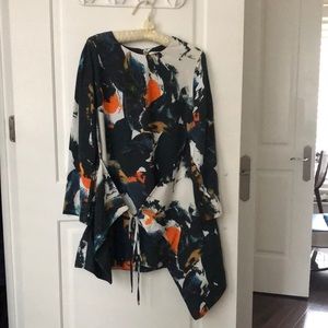 Enter the room with a splash in this COS tunic